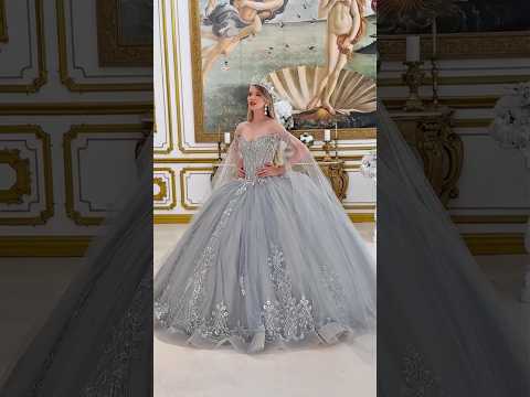 Silver Quinceañera Dress with V-Neck Corset, Jeweled Embellishments, Detachable Cape Sleeves and Bow