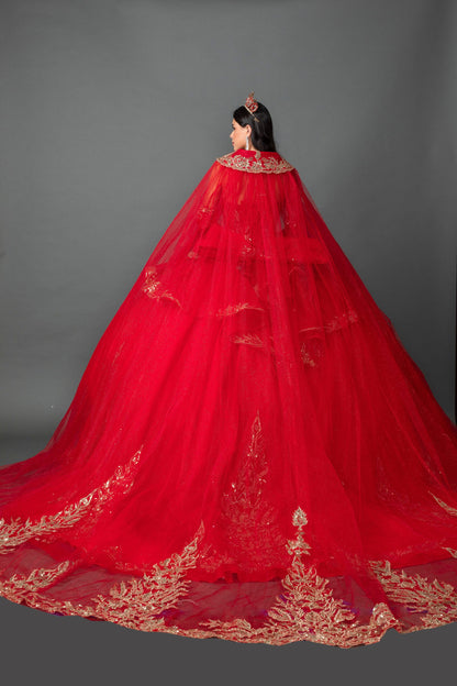 Woman back-facing in red off-shoulder ball gown quinceañera dress with lace-up corset bodice, ornate appliqué, detachable hooded cape, and cascading tulle skirt