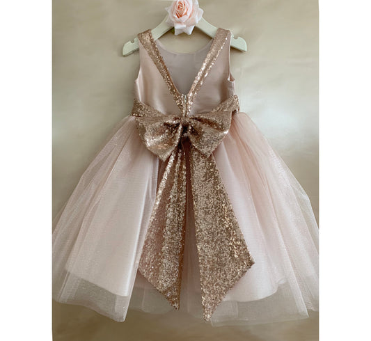 Rose Gold USA Made | Sequin V-Back Tulle Flower Girl Dress with detachable Ribbon pin - back view of dress on hanger with beautiful long bow