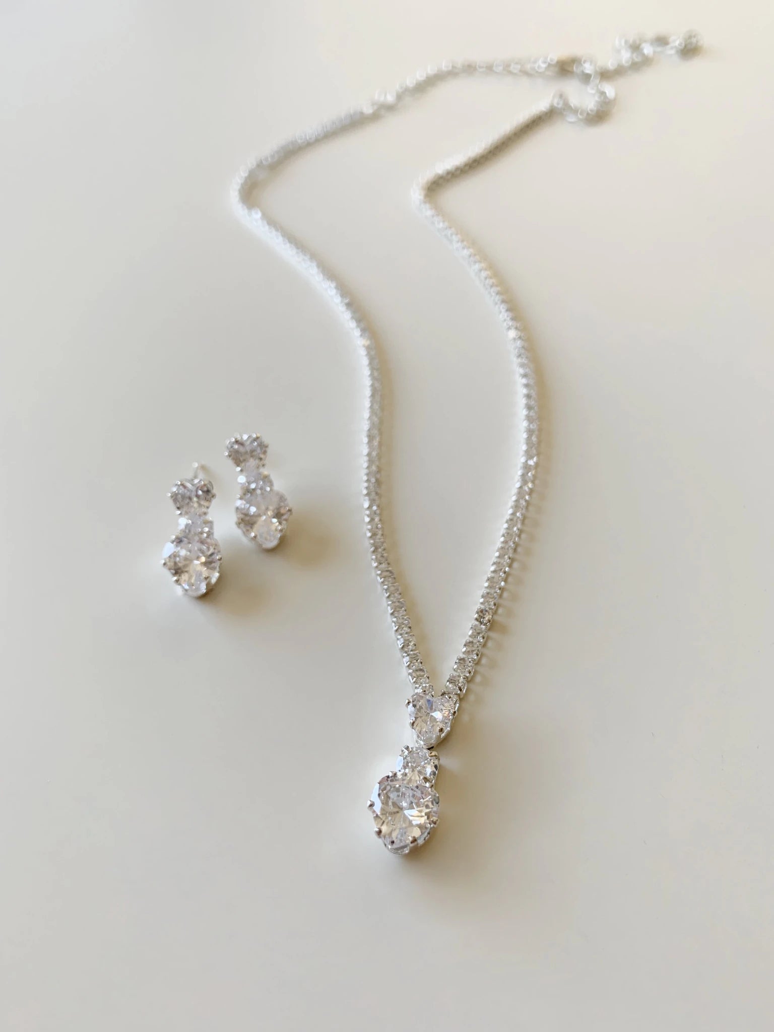 Silver rhinestone heart bridal necklace and earrings set.