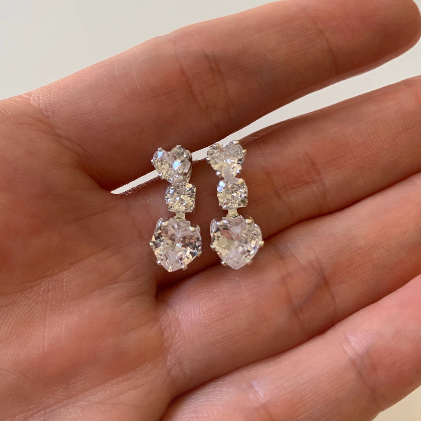 Silver rhinestone heart bridal necklace and earrings set.