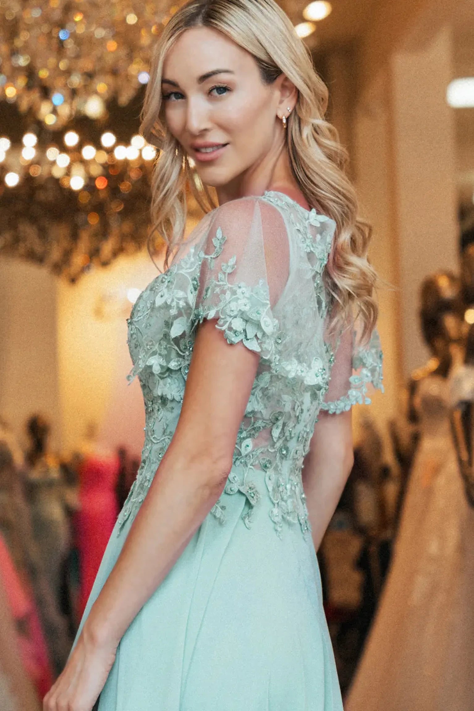Dusty Rose mother of the bride dress featuring embellished bodice flowing into a chiffon a-line skirt