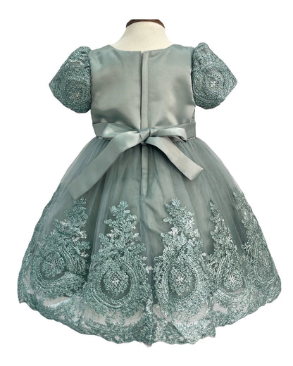 Green sage embroidered dress on a mannequin with a white background