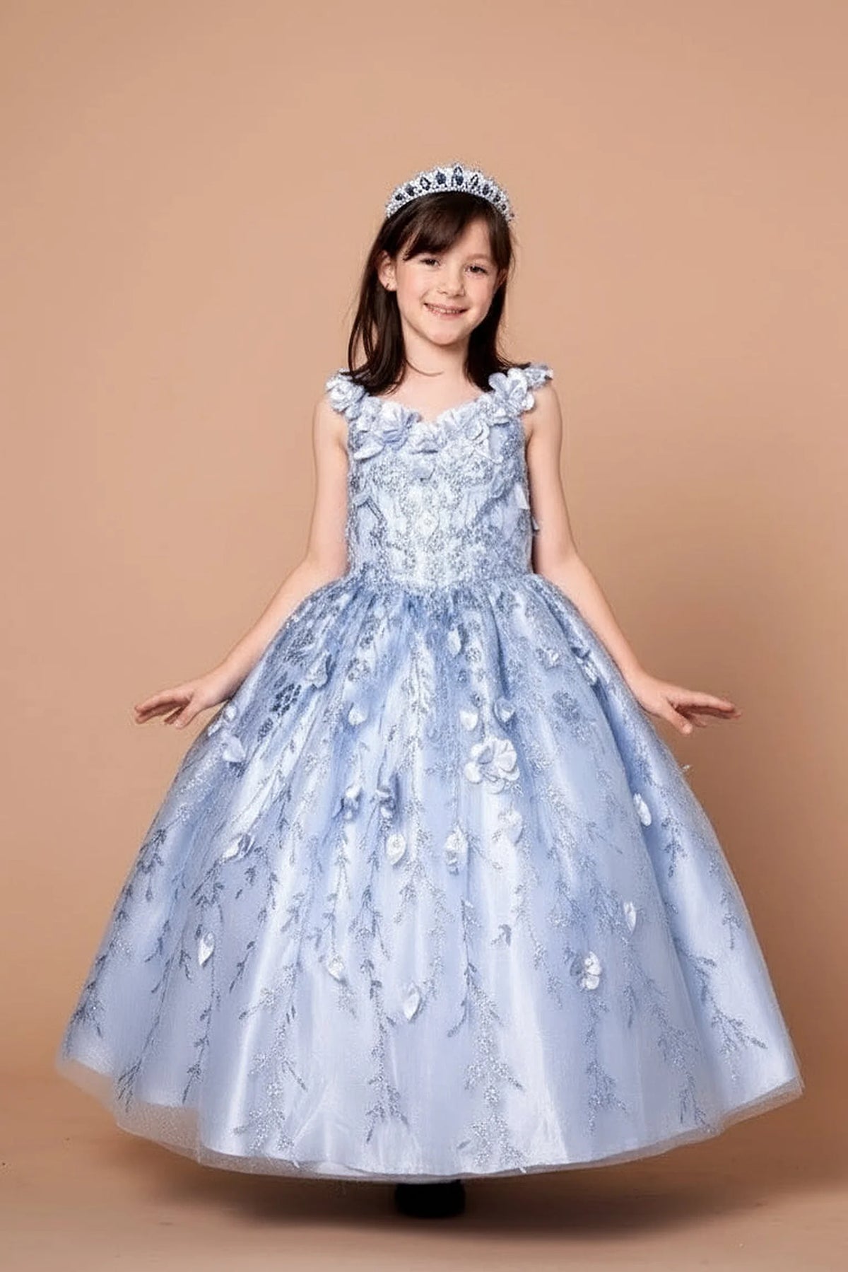 The formal silhouette presents, the Bahama Blue mini quince dress showcases off-the-shoulder bodice with dimensional flower trim and removable cape over a glittering tulle skirt.