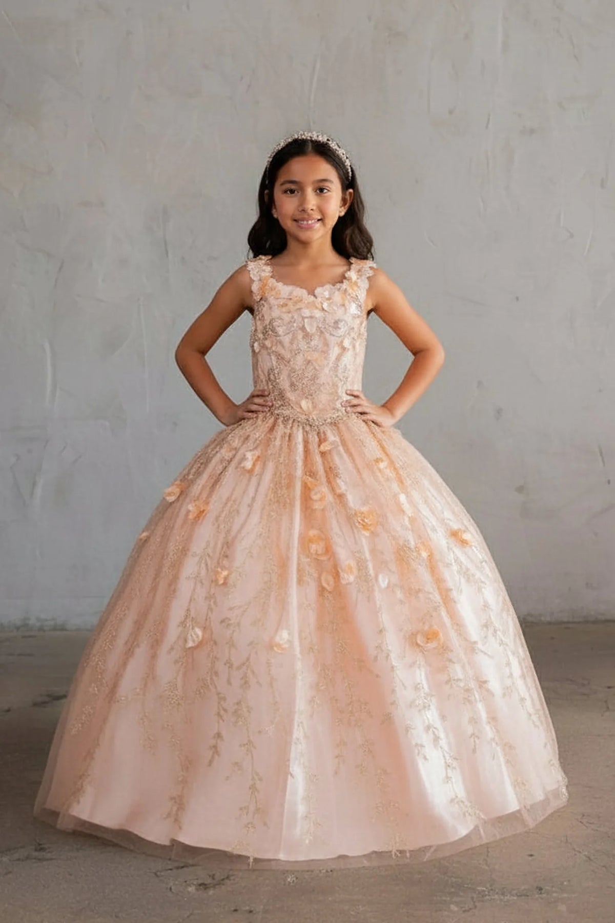 An alternate angle captures removable cape over a glittering tulle skirt on the Blush/Gold mini quince dress.