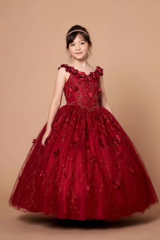 Across the silhouette, the Burgundy mini quince dress showcases off-the-shoulder bodice with dimensional flower trim and removable cape over a glittering tulle skirt.