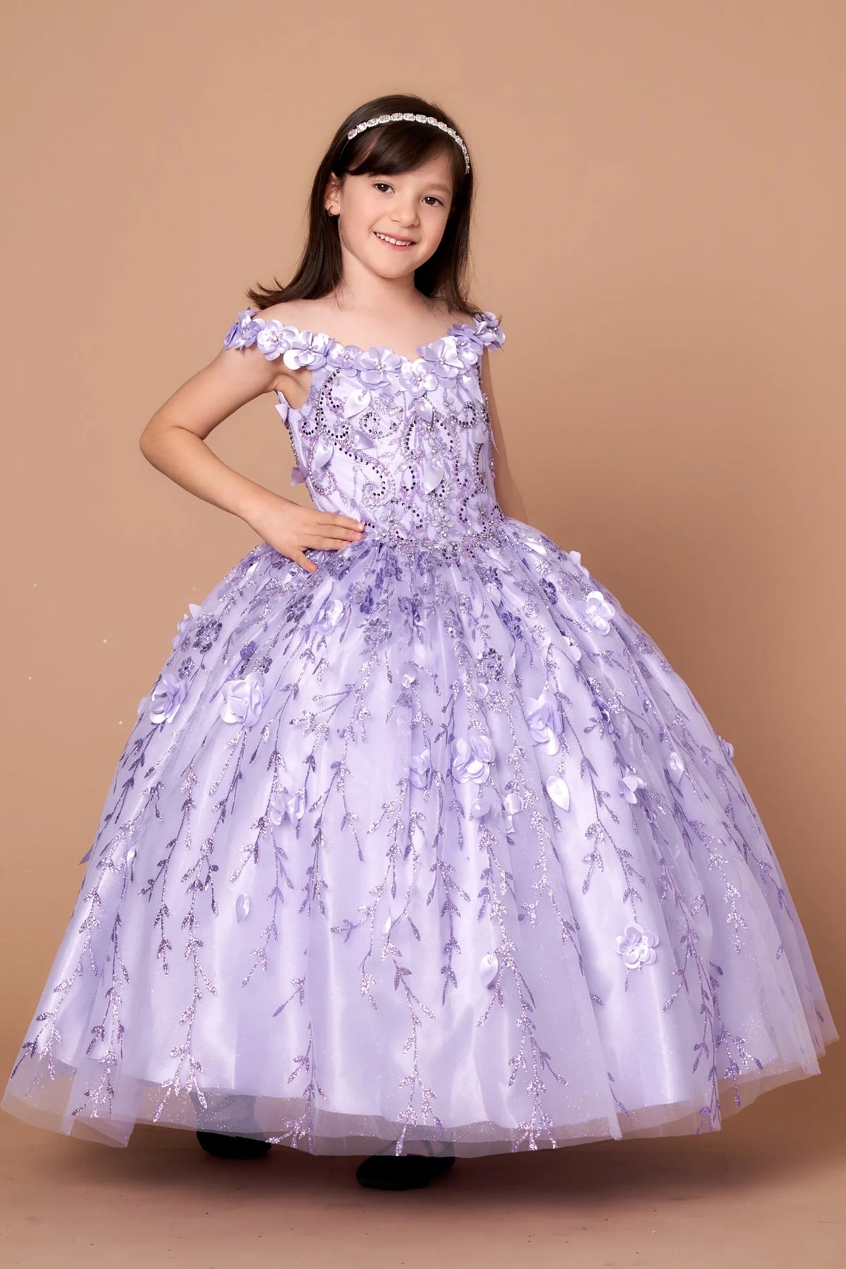 Rich texture defines, the Lilac mini quince dress showcases off-the-shoulder bodice with dimensional flower trim and removable cape over a glittering tulle skirt.