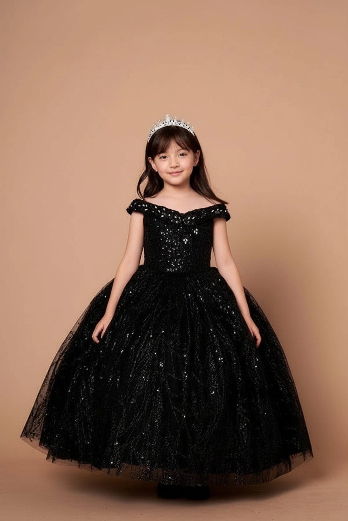 At the bodice and skirt, the Black mini quince dress showcases off-the-shoulder bodice with allover sequins and glitter and matching cape over a full sparkling skirt.