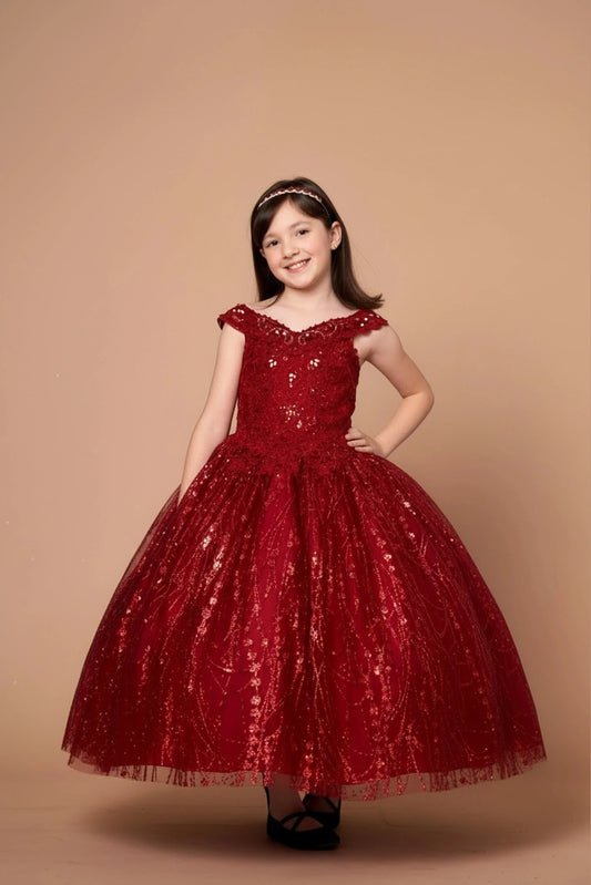 In full view, the Burgundy mini quince dress showcases off-the-shoulder bodice with allover sequins and glitter and matching cape over a full sparkling skirt.