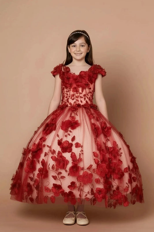 Seen at full length, the Burgundy mini quince dress showcases bold floral embroidery from bodice to hem and full tulle skirt with dimensional appliqué.