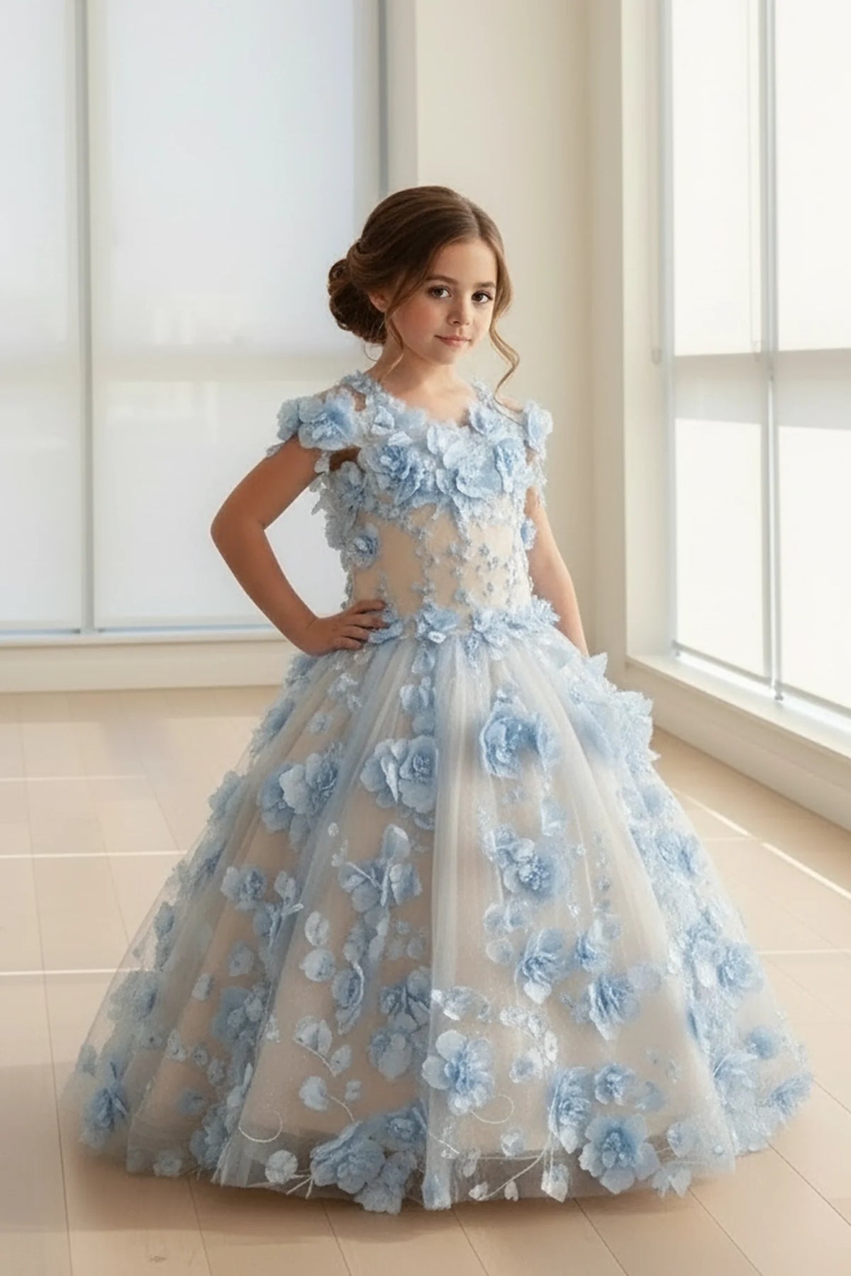 The formal silhouette presents, the Light Blue mini quince dress showcases bold floral embroidery from bodice to hem and full tulle skirt with dimensional appliqué.