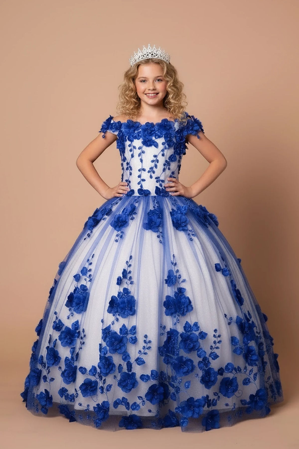 From the neckline down, the Royal Blue mini quince dress showcases bold floral embroidery from bodice to hem and full tulle skirt with dimensional appliqué.