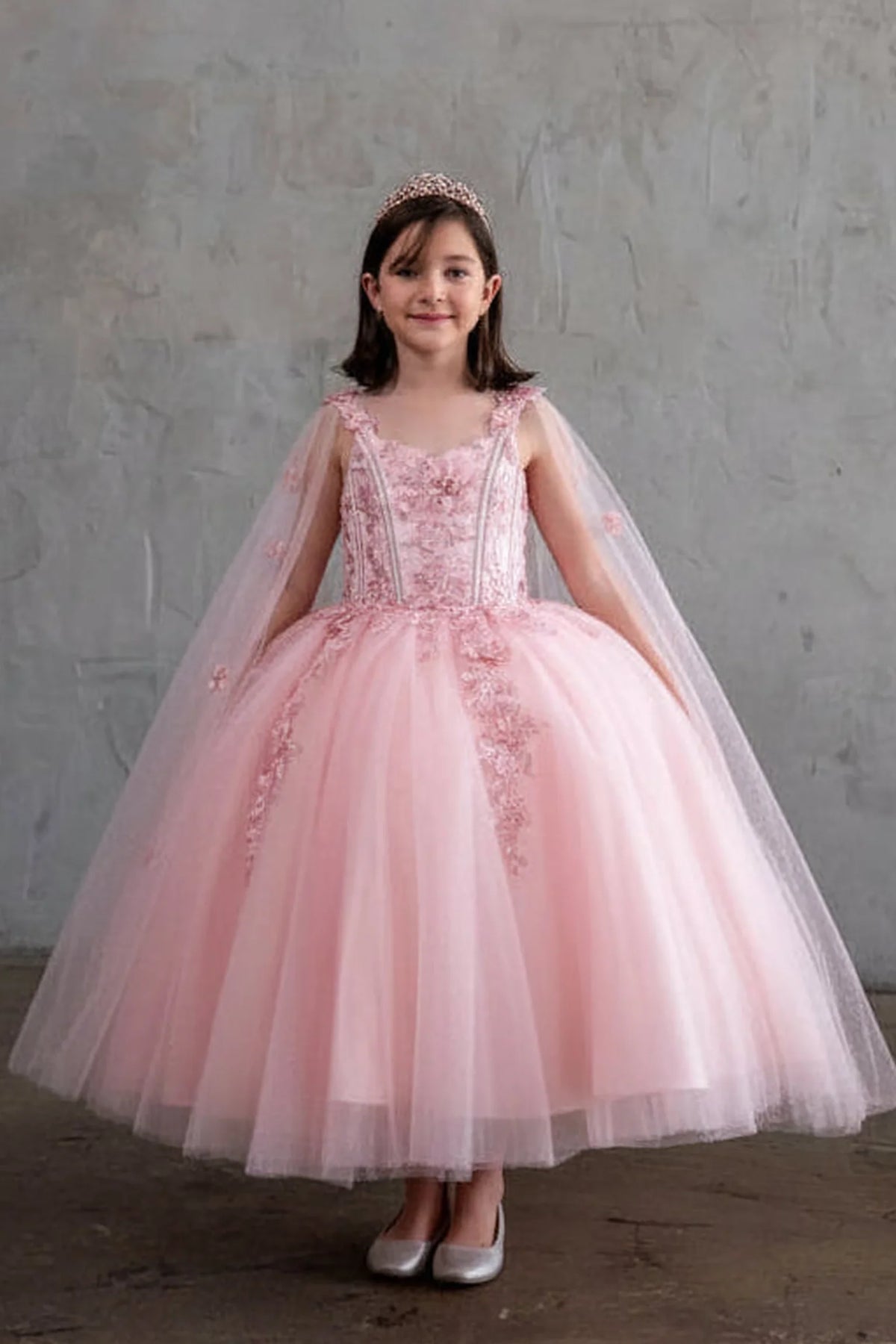 Sparkling details shape, the Bubble Pink mini quince dress showcases sheer flowing cape sleeves and floral embroidered bodice and full tulle skirt.