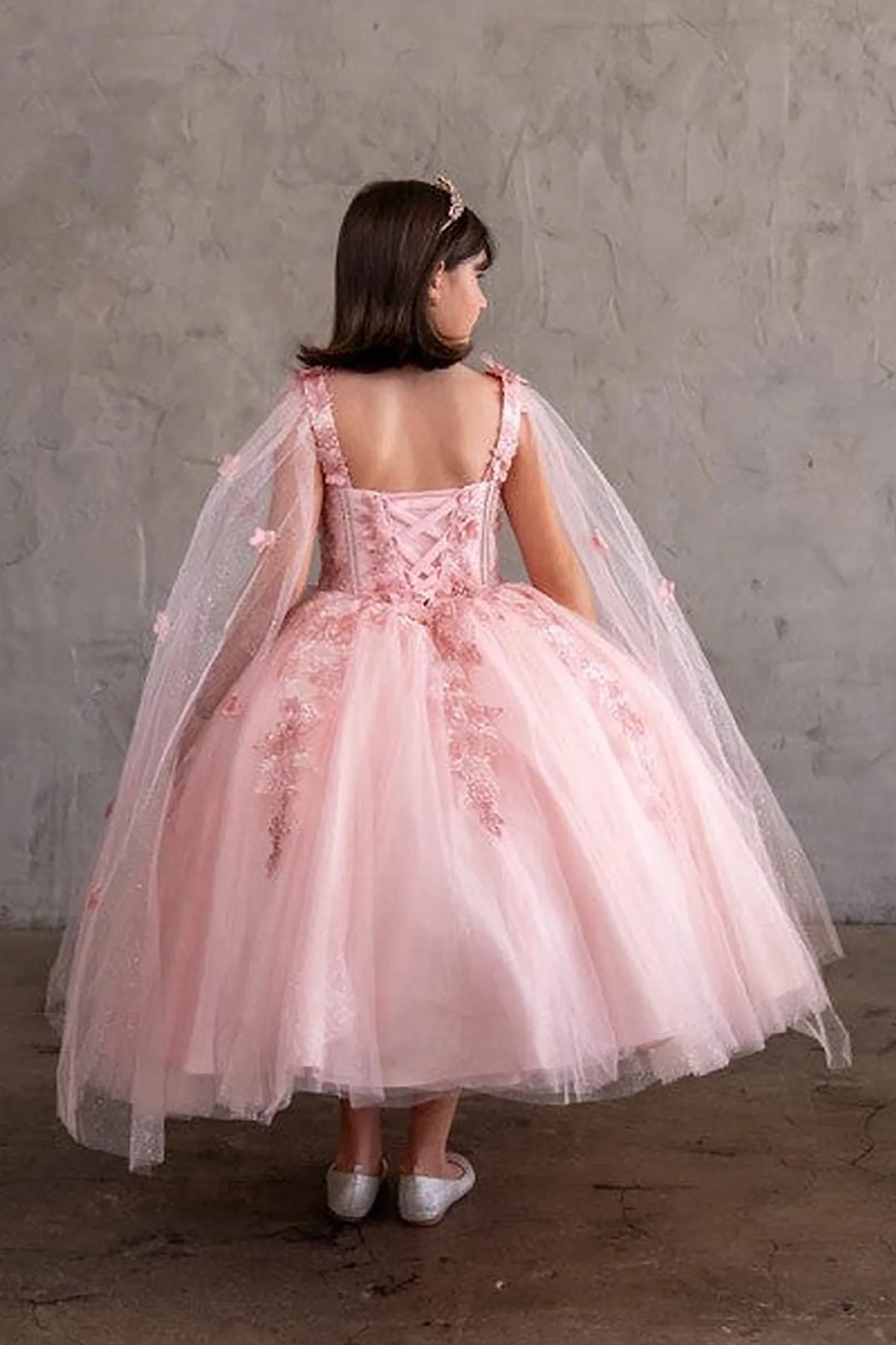 An alternate angle captures floral embroidered bodice and full tulle skirt on the Bubble Pink mini quince dress.