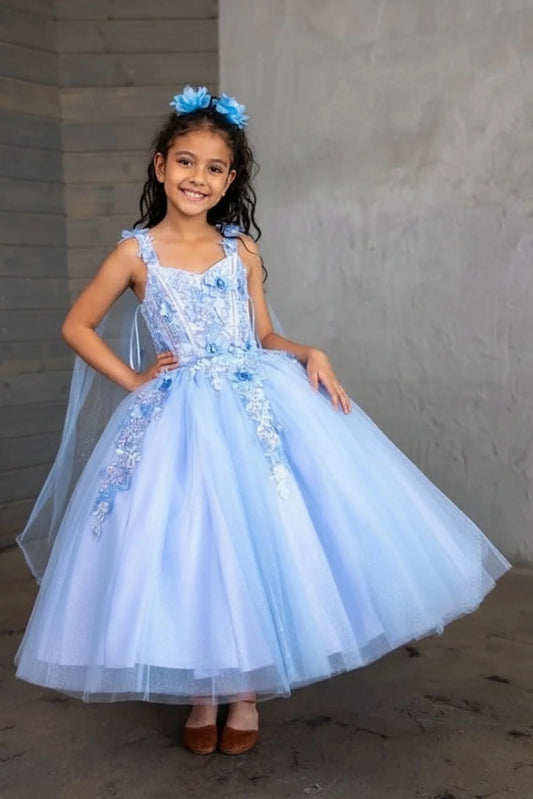 Delicate accents highlight, the Light Blue mini quince dress showcases sheer flowing cape sleeves and floral embroidered bodice and full tulle skirt.