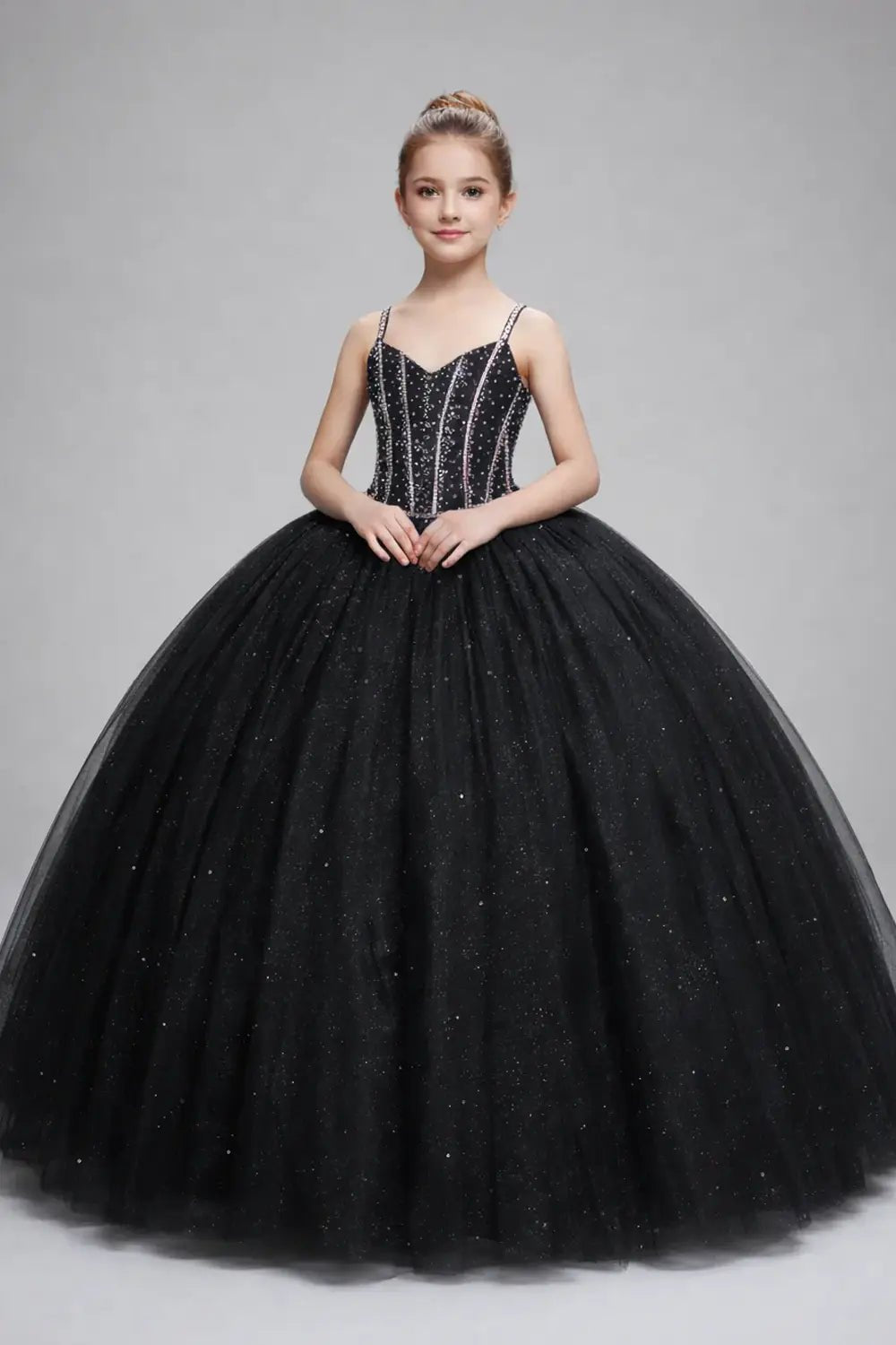 Front view of stunning black mini quince dress with 3D floral appliqué bodice, glitter tulle accents, and voluminous layered skirt.