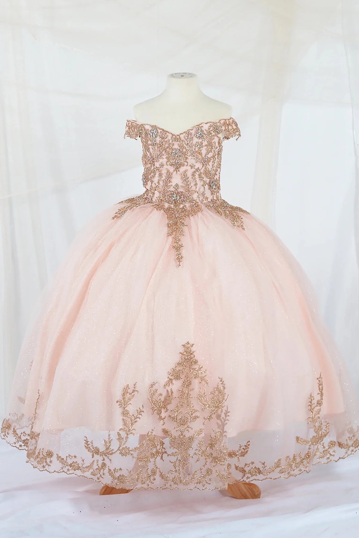 Blush kids mini quinceañera mini quince dress with lace appliqué and A-line glitter tulle skirt.
