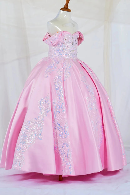 Skirt detail shows pink fully satin mini quince dress with floral embroidery and glittered tulle skirt.