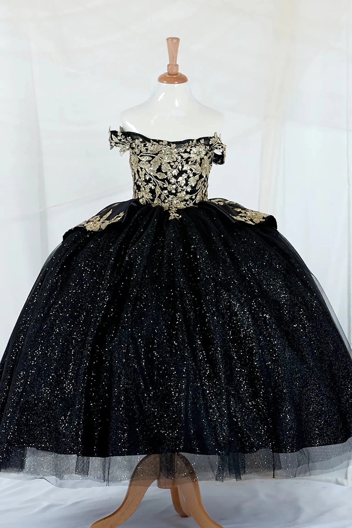 Black kids mini quinceañera mini quince dress with beaded embroidery and layered glitter skirt.