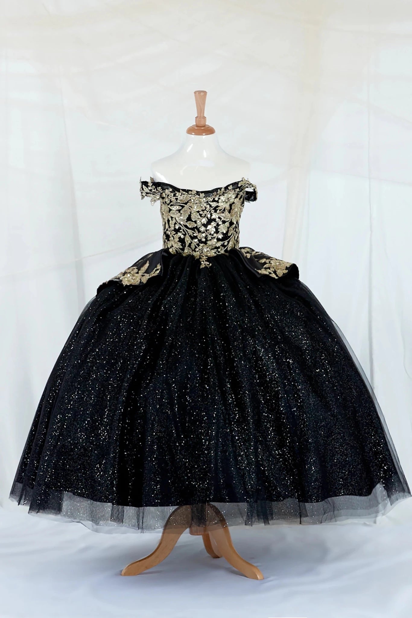 Black kids mini quinceañera mini quince dress with beaded embroidery and layered glitter skirt.