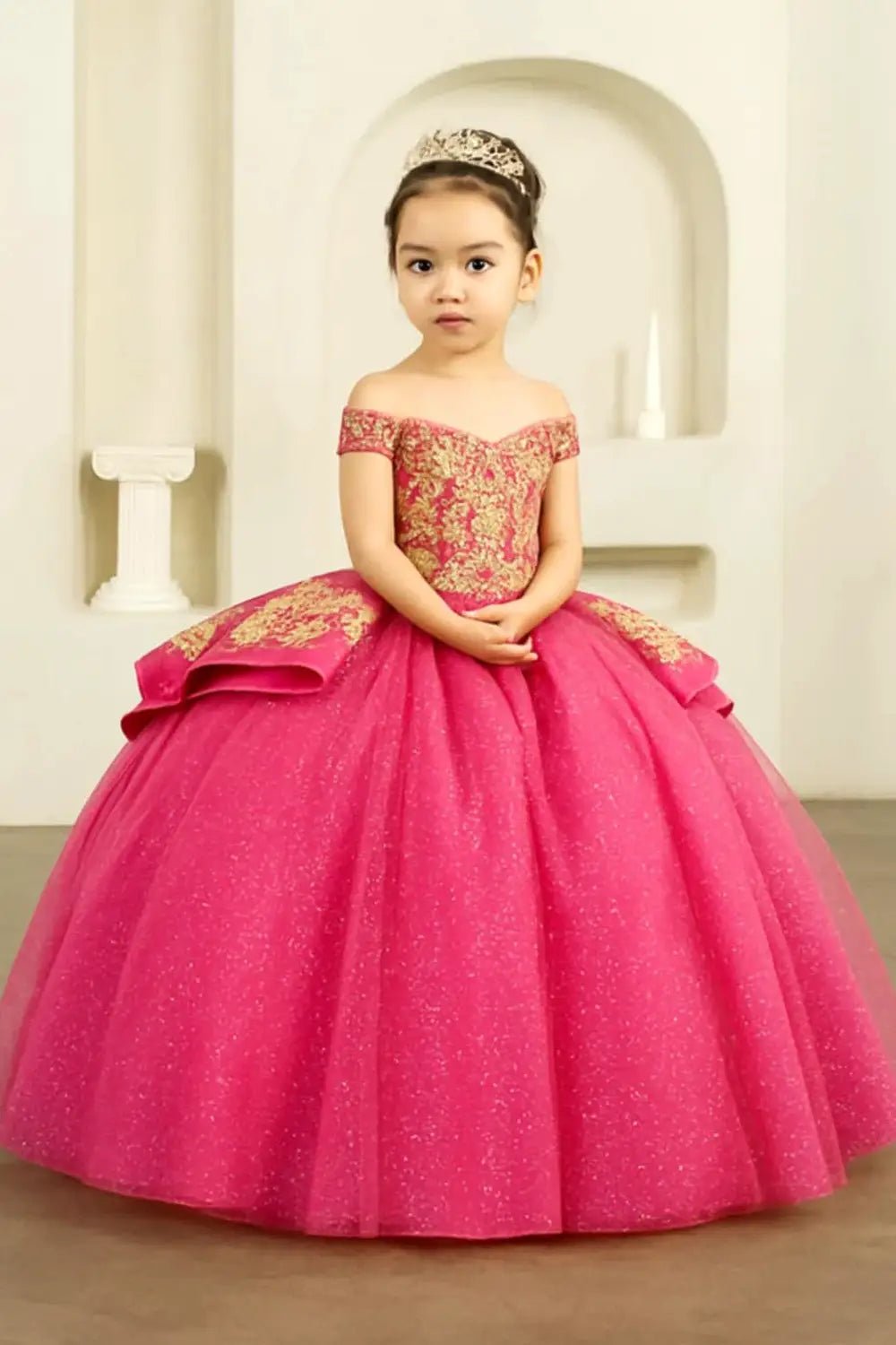 Front view of hot pink mini quince dress with sparkling beaded bodice and voluminous layered skirt.