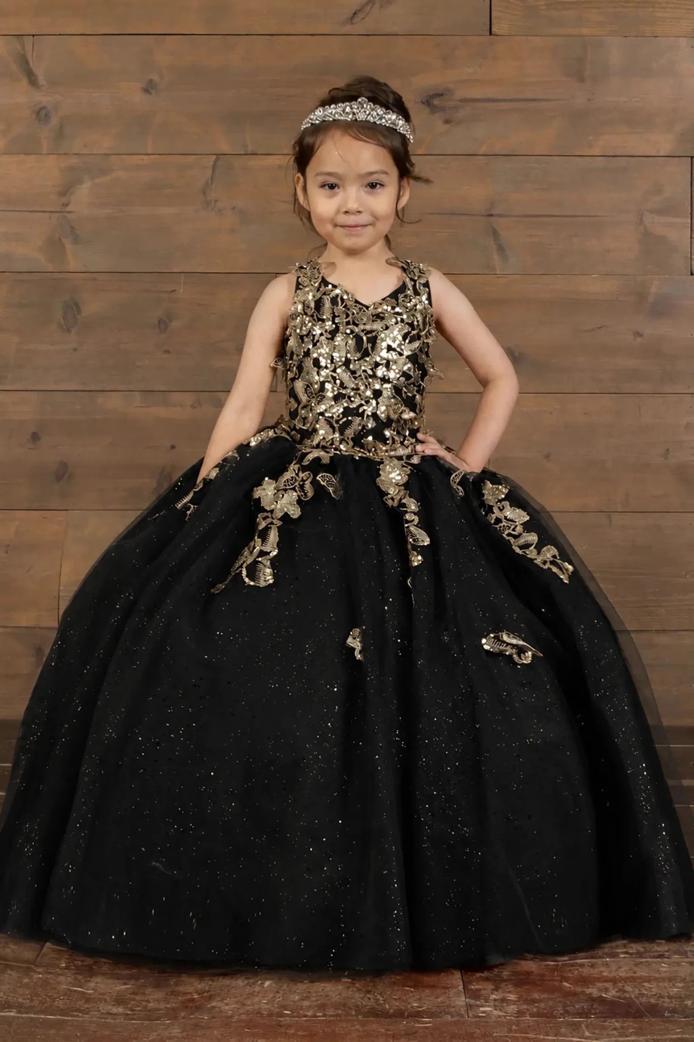 Black mini quince dress with 3D floral applique bodice and glitter tulle layered skirt.
