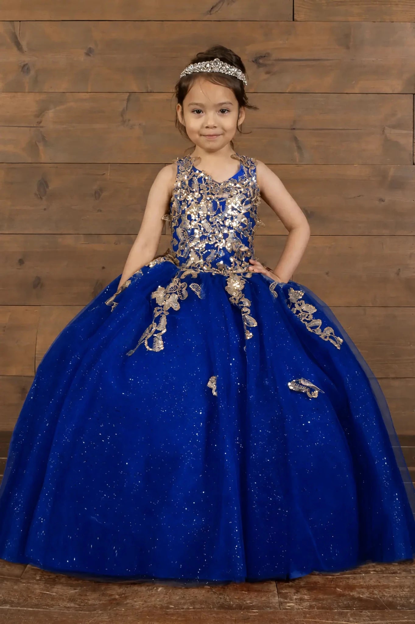 Front view of stunning royal blue mini quince mini quince dress with 3D floral appliqué bodice and glitter tulle layered skirt.