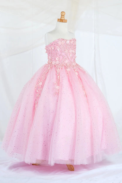 Side-facing display of a bubble-pink mini quince dress featuring a strapless 3D floral appliqué bodice and a full glitter tulle layered skirt.