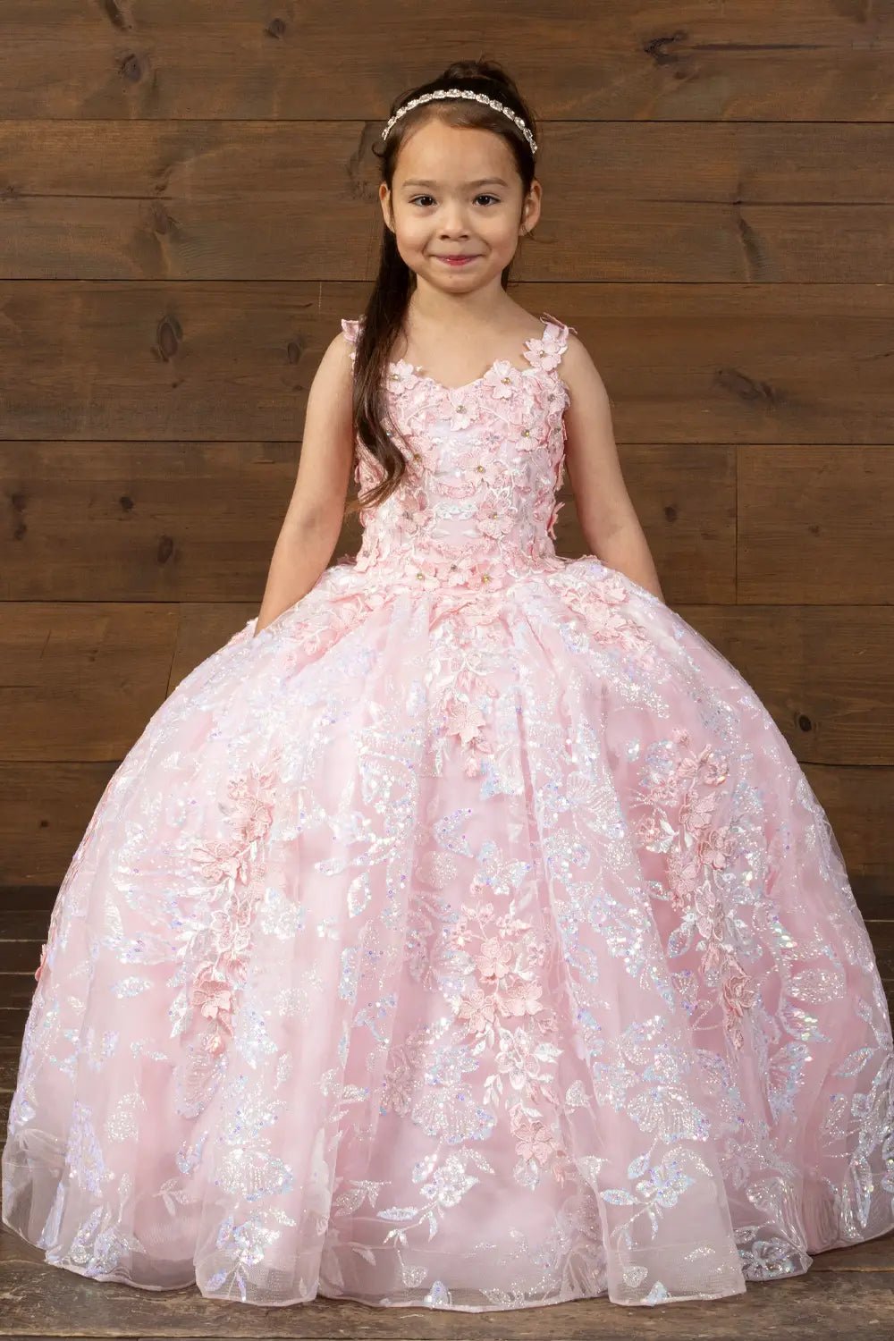 Front view of blush and gold mini quince dress with 3D flower appliqué bodice, butterfly accents, and glitter tulle layered skirt.