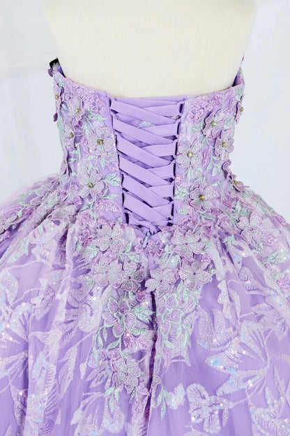 Close-up display highlighting the intricate 3D flower appliqué and delicate butterfly details on the bodice. Mini quince dress.