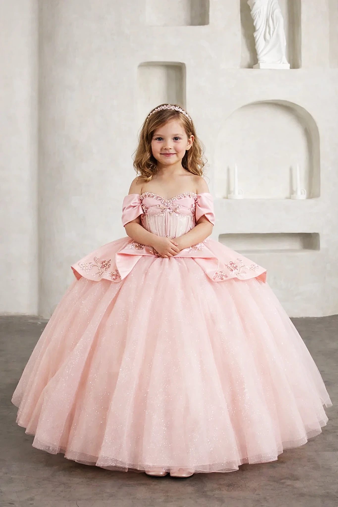 Front view of stunning blush mini quince dress with beaded fringe detail and 3D floral appliqué bodice, paired with glitter tulle layered skirt.
