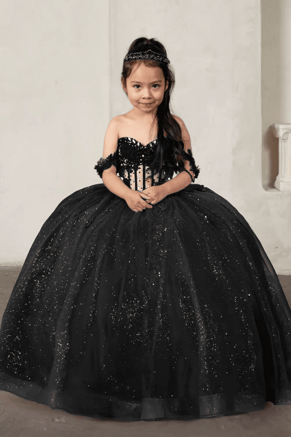 Front view of elegant royal blue mini quince dress with lace appliqué bodice and glitter tulle layered skirt.