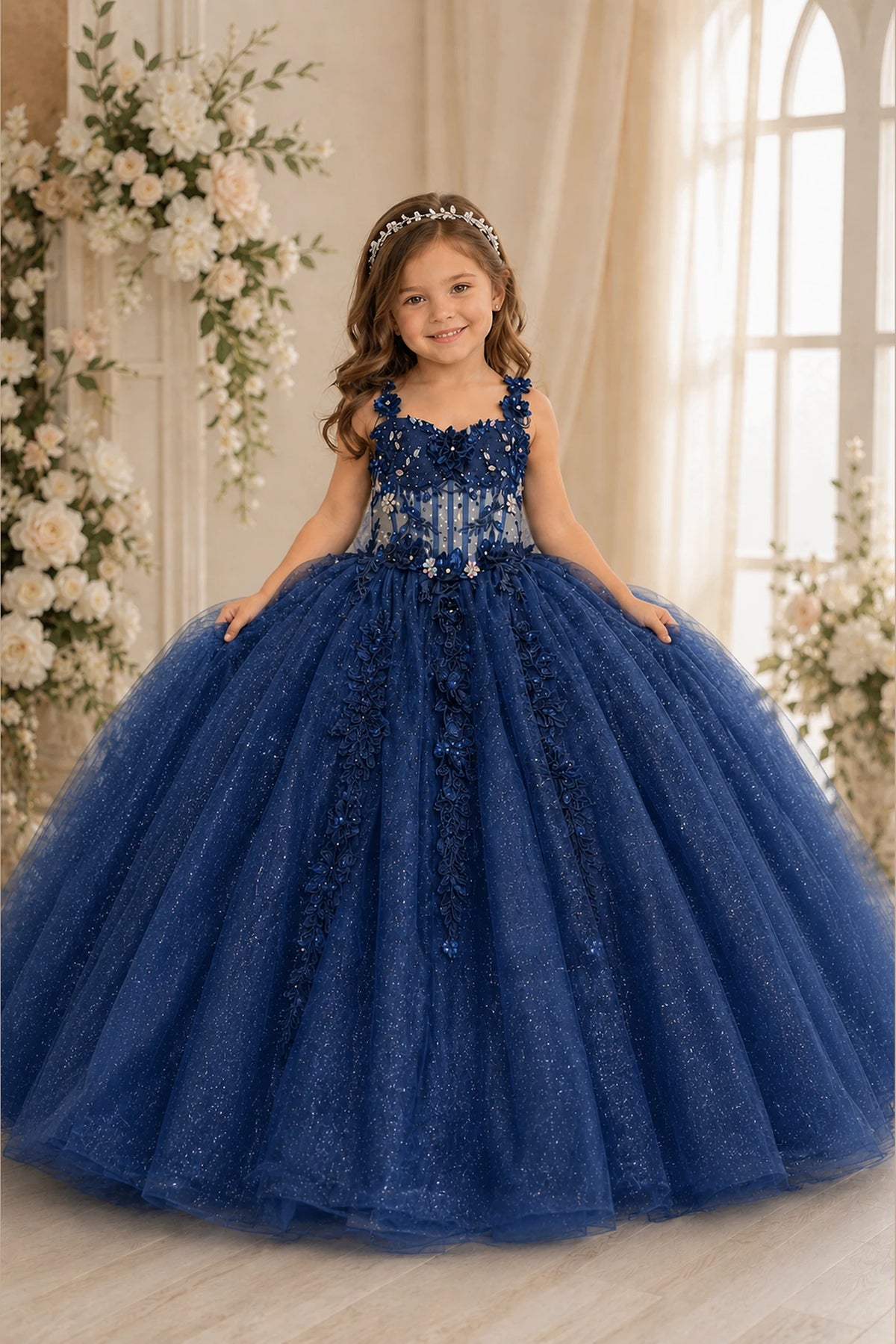 This second view emphasizes glitter tulle skirt with a detachable back bow on the Navy mini quince dress.