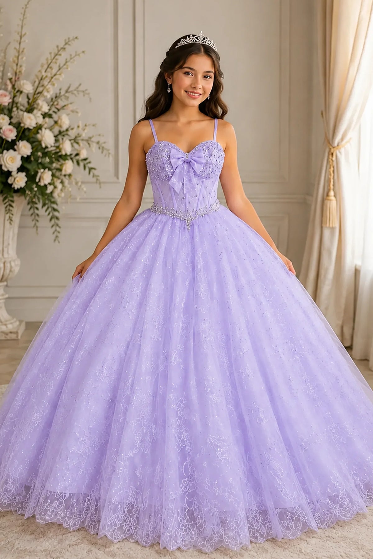 The formal silhouette presents, the Lilac mini quince dress showcases romantic off-the-shoulder lace appliqué bodice and a-line glitter tulle overlay with a lace-up back.
