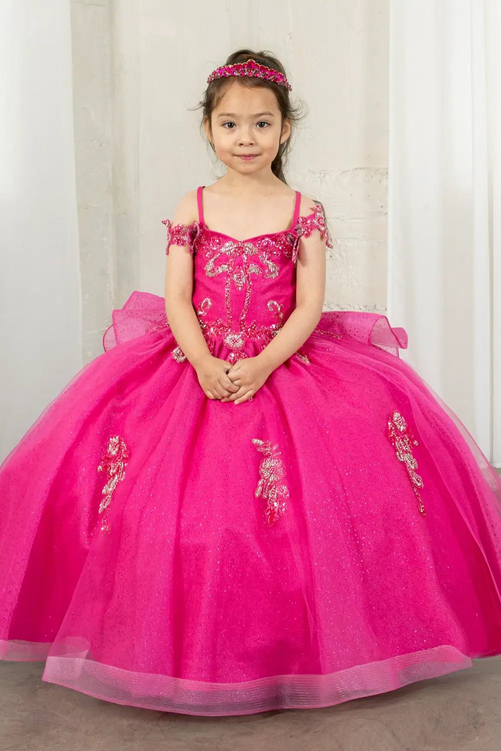 Front view of elegant fuchsia mini quince dress with beaded corset bodice, layered glitter tulle skirt and butterfly appliques.
