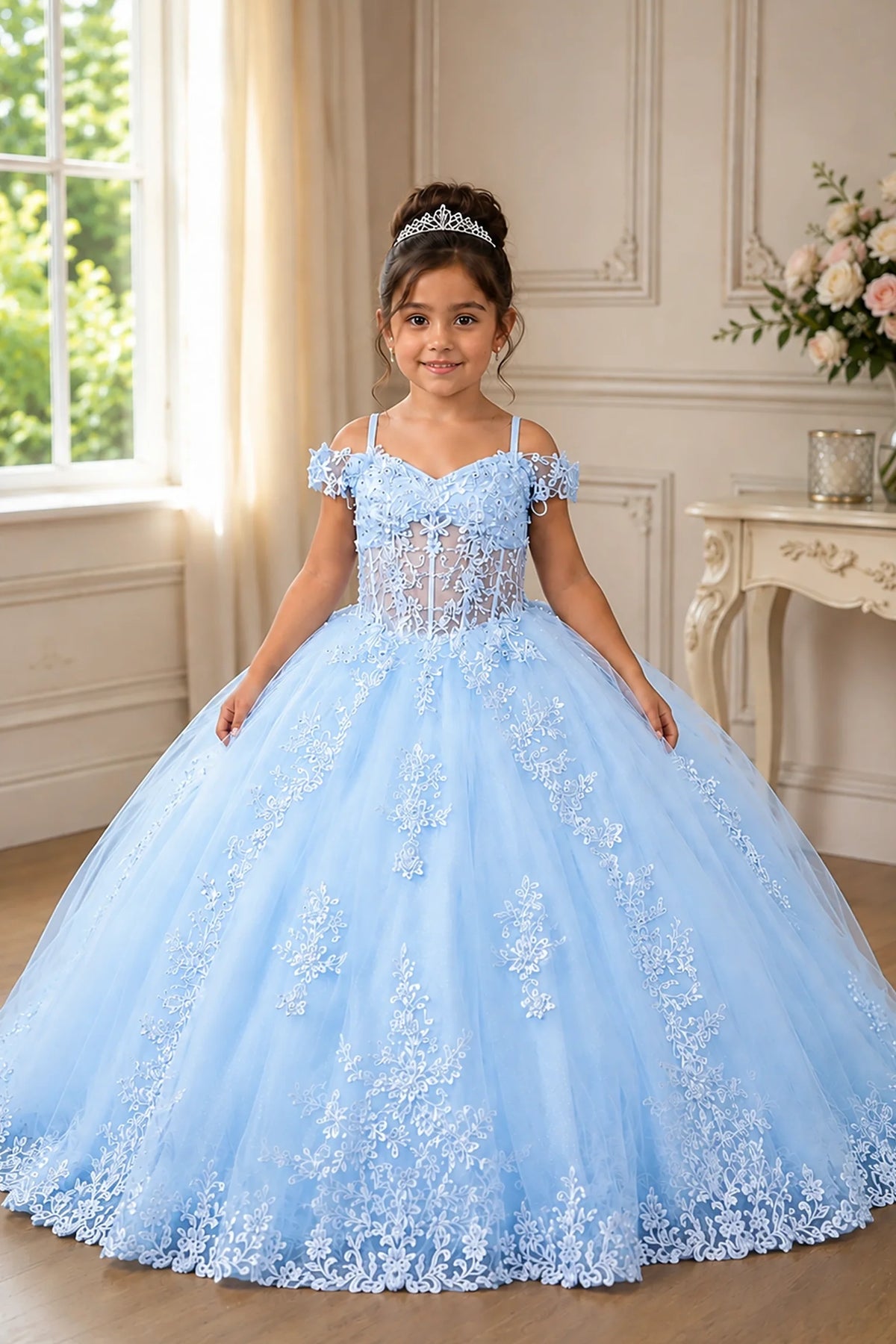 In full view, the Bahama Blue mini quince dress showcases embroidered floral lace bodice and full tulle skirt with a large bow at the back.
