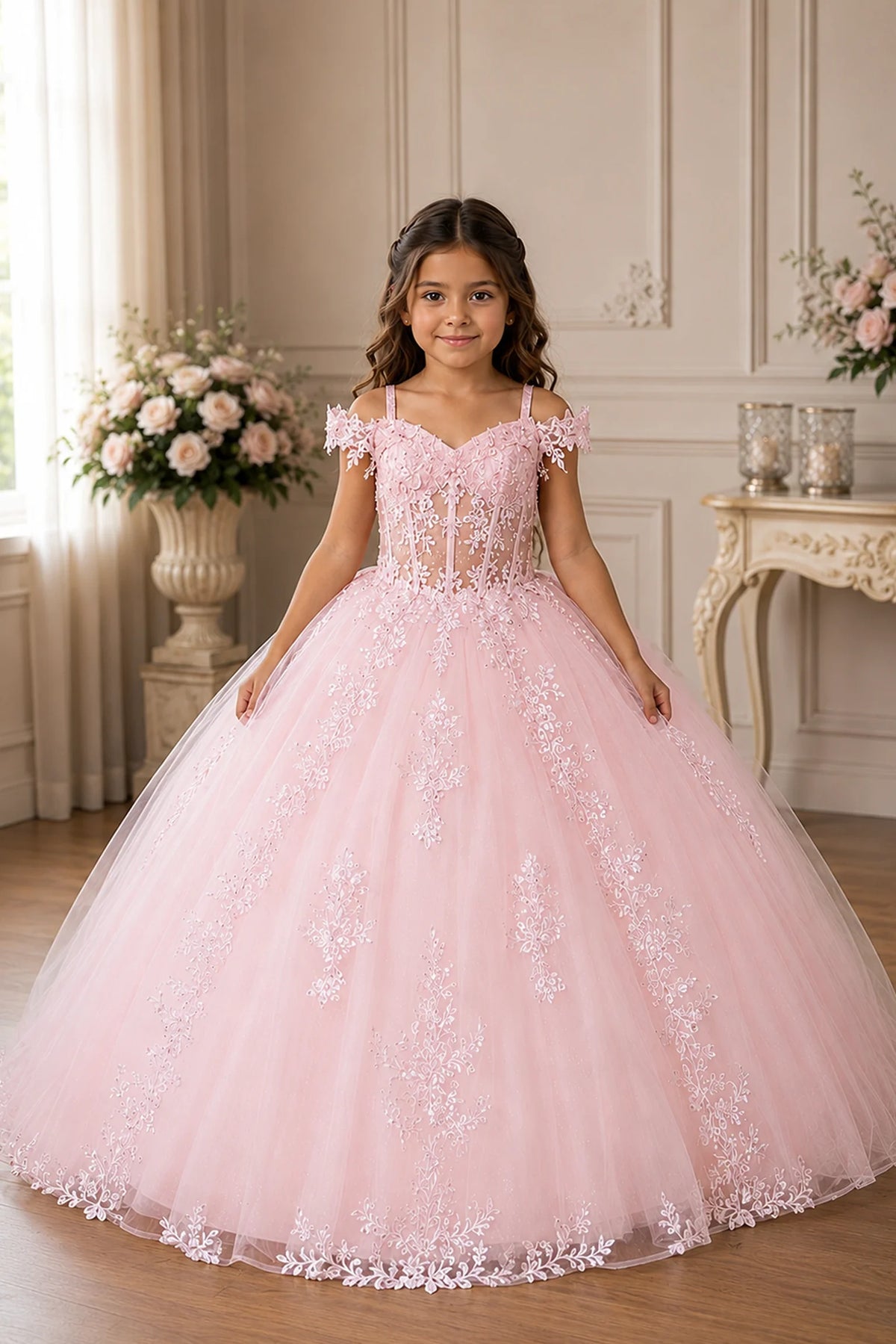 Across the silhouette, the Blush Pink mini quince dress showcases embroidered floral lace bodice and full tulle skirt with a large bow at the back.