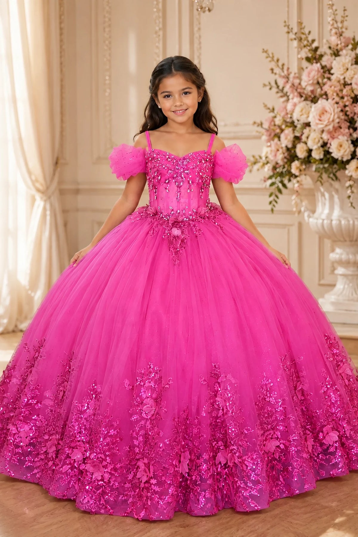 Across the silhouette, the Fuchsia mini quince dress showcases soft tulle puff sleeves and a lace-up bodice and floral lace trim around the full ball gown skirt.