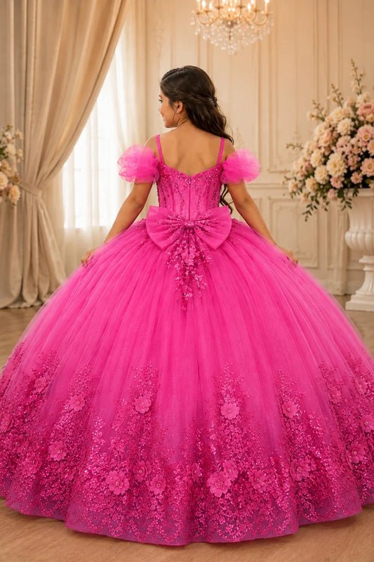 The reverse view reveals, the Fuchsia mini quince dress displays its lace-up finish and floral lace trim around the full ball gown skirt.