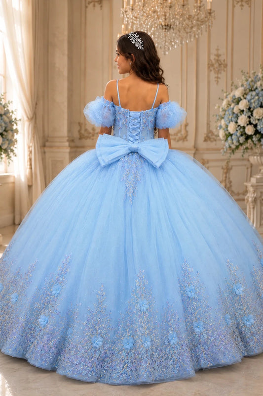 At the lace-up back, the Light Blue mini quince dress displays its lace-up finish and floral lace trim around the full ball gown skirt.