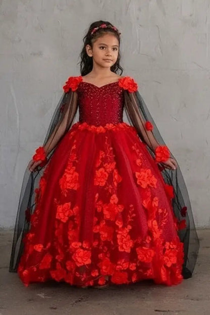 Kid standing front-facing in elegant red ball gown with two-tone tail, matching cape, and voluminous layered tulle skirt