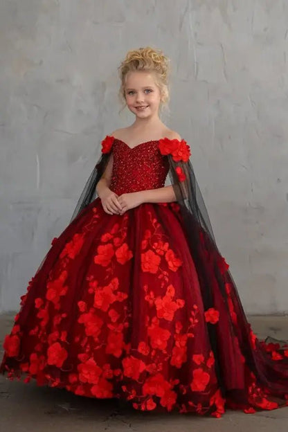 Red ball gown with embroidered bodice, matching cape detail, and sweetheart neckline

