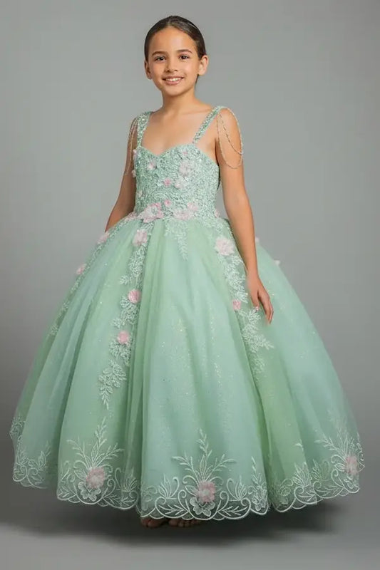 Young woman standing front-facing in stunning sage ball gown with beaded fringe bodice, 3D floral appliqués, and voluminous layered skirt

