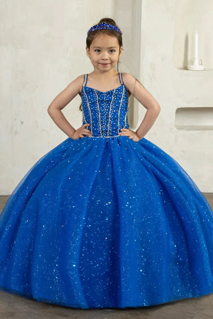 Kid standing front-facing in stunning royal blue ball gown with 3D floral appliqué bodice and glitter tulle layered skirt