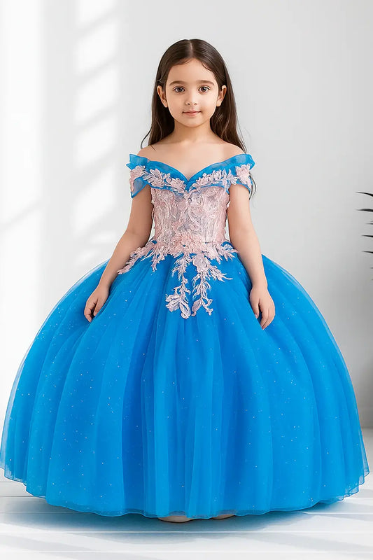 Kid standing front-facing in elegant turquoise and blush ball gown with fitted bodice, detachable bow accent, and glitter tulle layered skirt
