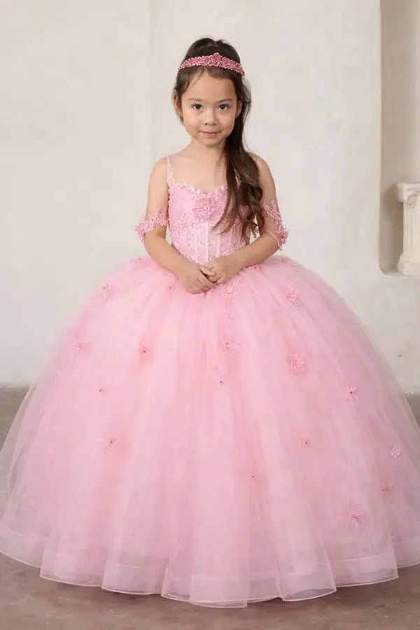 Kid standing front-facing in elegant bubble pink ball gown with crystal beaded bodice, detachable bow accent, and glitter tulle layered skirt