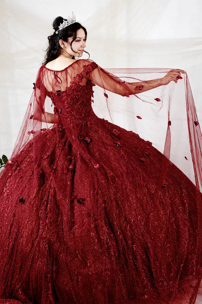Back view of burgundy quinceanera dress showing detachable sheer cape with 3D floral appliques