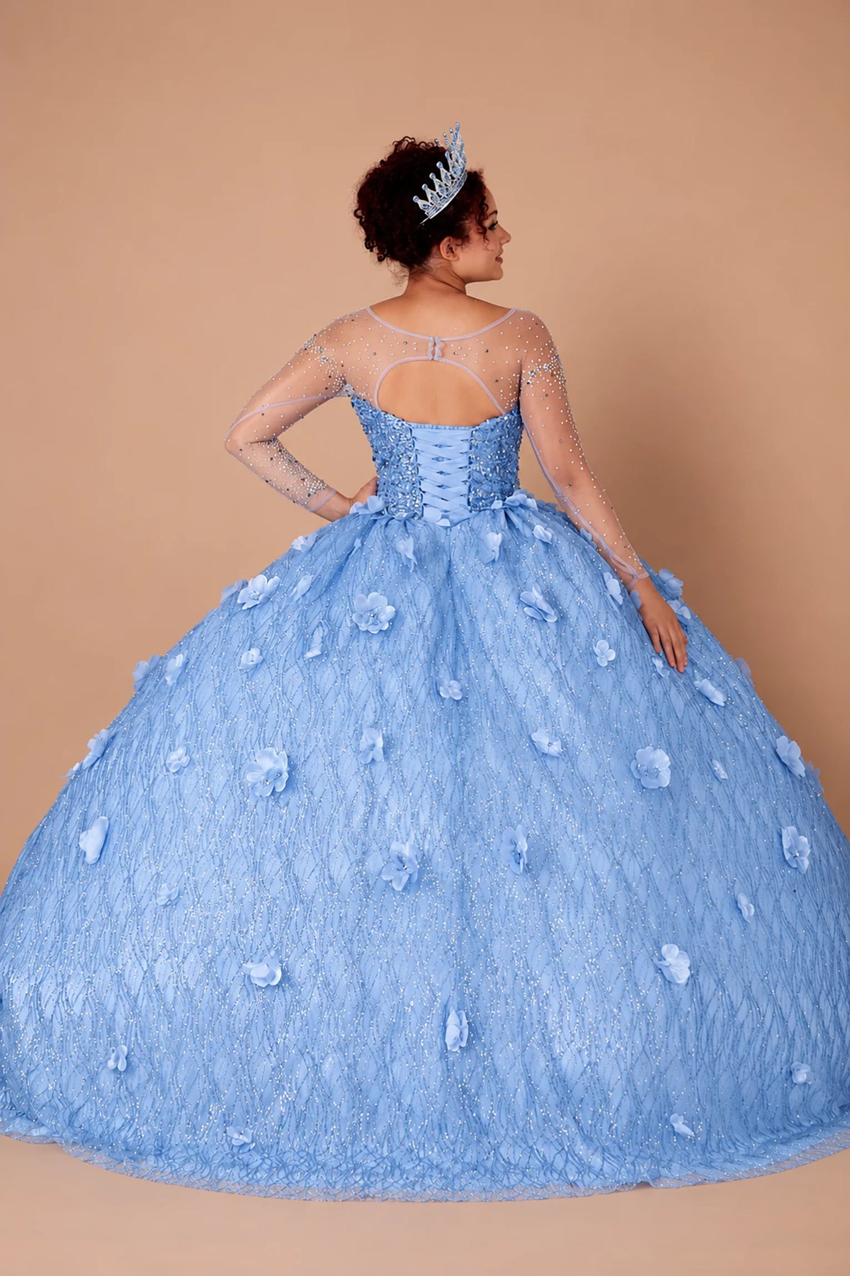 From behind, the Dusty Blue quinceañera ball gown reveals a shaped lace-up back and the sweep of the full skirt.