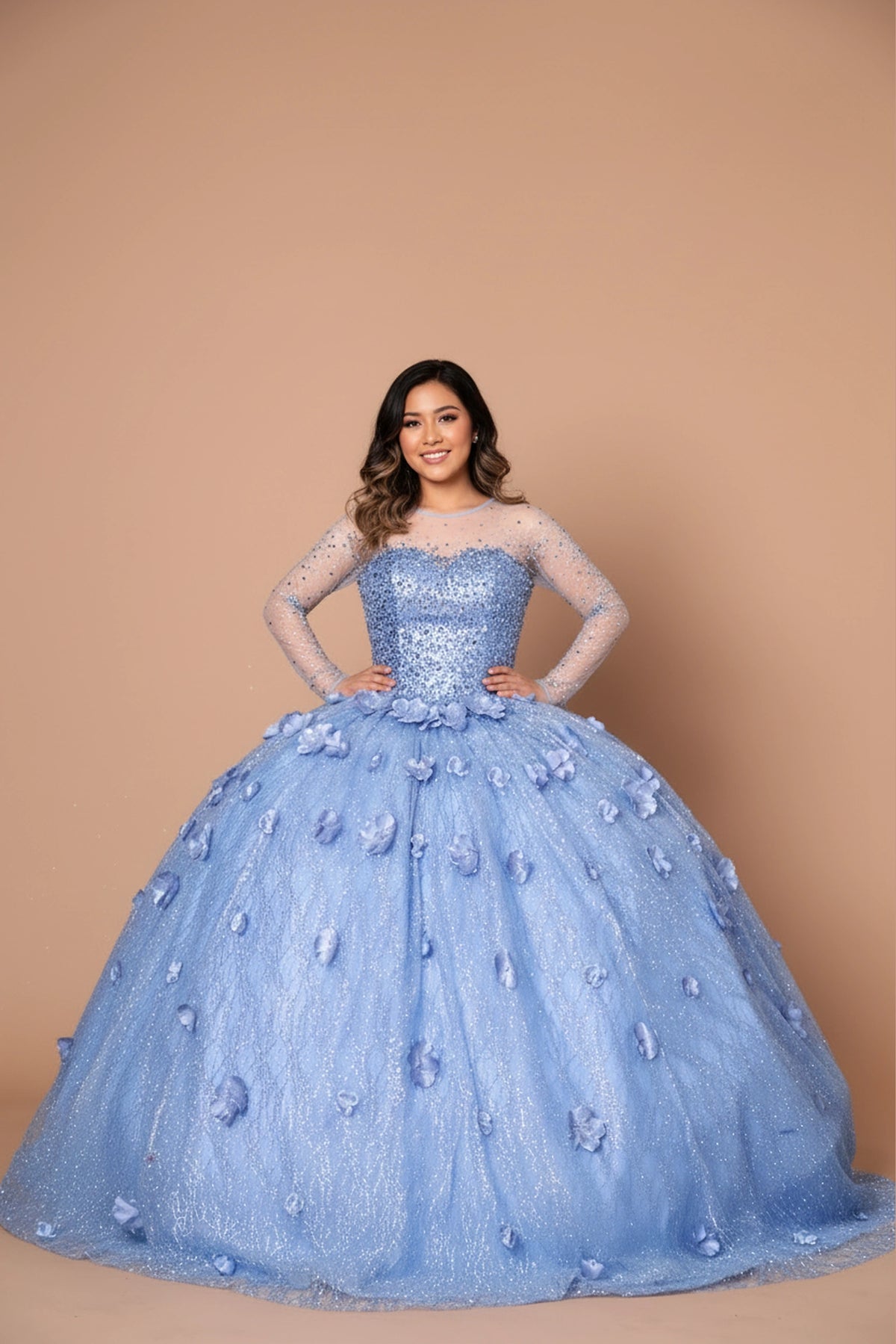 Dimensional flowers across the textured skirt defines the Dusty Blue quinceañera dress in this detailed view.