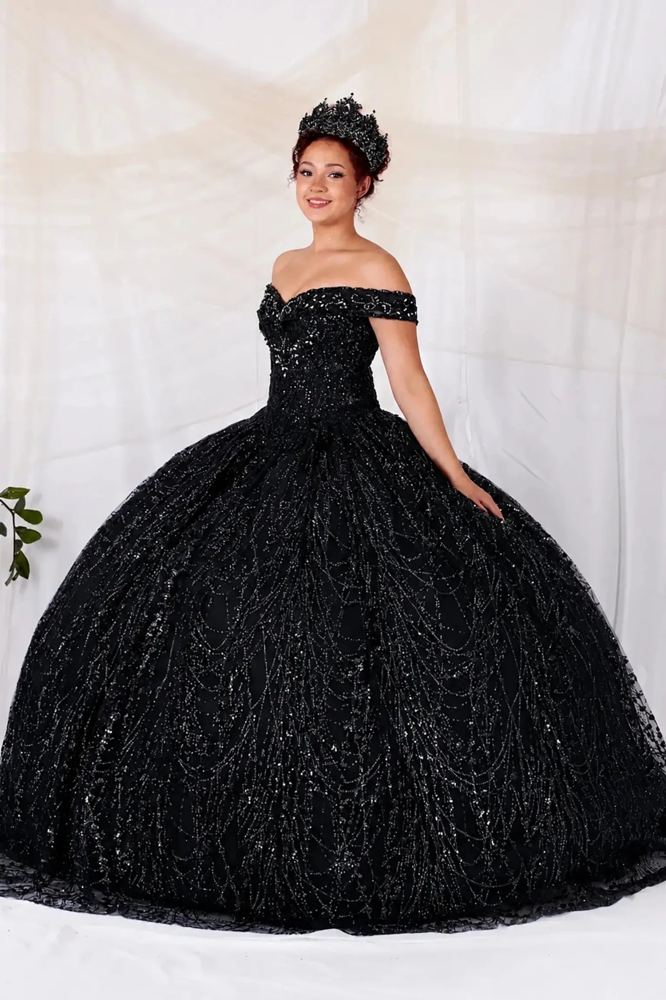 black sequin quinceanera dress with off the shoulder design